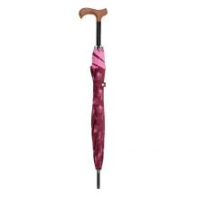 walking stick umbrella closed,pink leaves on bordeaux red